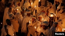 Ethiopian Orthodox pilgrims attend Christmas Eve celebration in Bete Mariam (House of Mary) monolithic Orthodox church in Lalibela, Ethiopia. Taken January 6, 2018. 