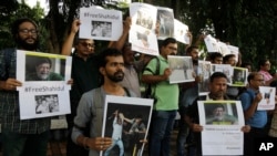 Indian journalists hold placards protesting against the attack on journalists and the arrest of Shahidul Alam, a renowned photographer and Bangladeshi activist as they gather outside Press Club in Kolkata, India, Wednesday, Aug. 8, 2018.