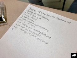 A list of the characteristics of an abusive relationship is made by students in small groups during a lesson by teachers from the nonprofit Raphael House, at Central Catholic High School in Portland, Ore., on April 15, 2019.