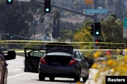 A car, allegedly used by the gunman who killed one at the Congregation Chabad synagogue in Poway, is pictured, few hundred feet from the Interstate 15 off-ramp north of San Diego, California, April 27, 2019.