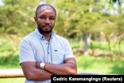 Rwandan veterinarian Olivier Nsengimana is at the Umusambi Village, a place for endangered grey crowned cranes in Kigali, Rwanda June 21, 2021. (REUTERS/Cedric Karemangingo)