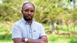 Rwandan veterinarian Olivier Nsengimana is at the Umusambi Village, a place for endangered grey crowned cranes in Kigali, Rwanda June 21, 2021. (REUTERS/Cedric Karemangingo)