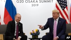 2019年6月28日特朗普(右)在大阪20國集團峰會期間會見普京。