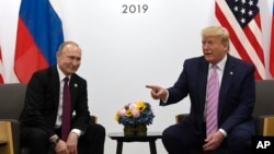 Владимир Путин и Дональд Трамп во время двусторонней встречи на полях саммита G-20 в Осаке, Япония, 28 июня 2019