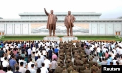 People gather to mark the occasion of the 23rd anniversary of the death of the country's founding father Kim Il Sung in this photo released by North Korea's Korean Central News Agency (KCNA) in Pyongyang July 8, 2017