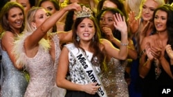 Miss Alaska Emma Broyles, center, reacts after being crowned Miss America on Dec. 16, 2021, in Uncasville, Conn. 