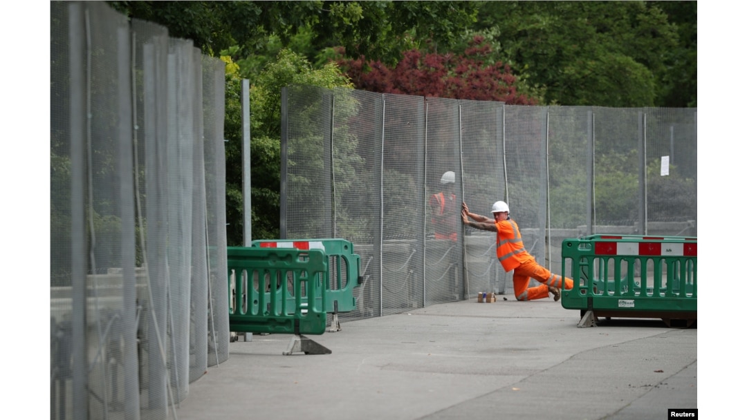Workmen construct fences ahead of the U.S. presidential visit, around the U.S. ambassador's residence in Regent's Park in London, May 31, 2019.