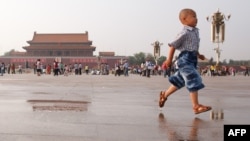 A boy runs on Tiananmen Square in Beijing on June 3, 2012, on the eve of the 23rd anniversary of China's brutal crackdown on democracy protests.