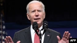 US President Joe Biden speaks about the situation in Myanmar in the South Court Auditorium of the Eisenhower Executive Office Building in Washington, DC, February 10, 2021. (Photo by SAUL LOEB / AFP)