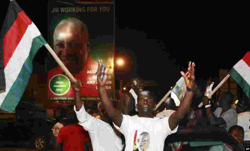 Supporters of President John Dramani Mahama celebrate in the streets after he was declared the winner of Ghana's presidential election, Accra, Ghana, December 9, 2012.