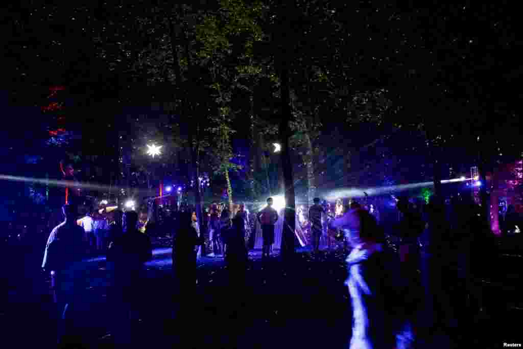 Revelers depart on the fourth and final day of the Firefly Music Festival in Dover, Delaware.