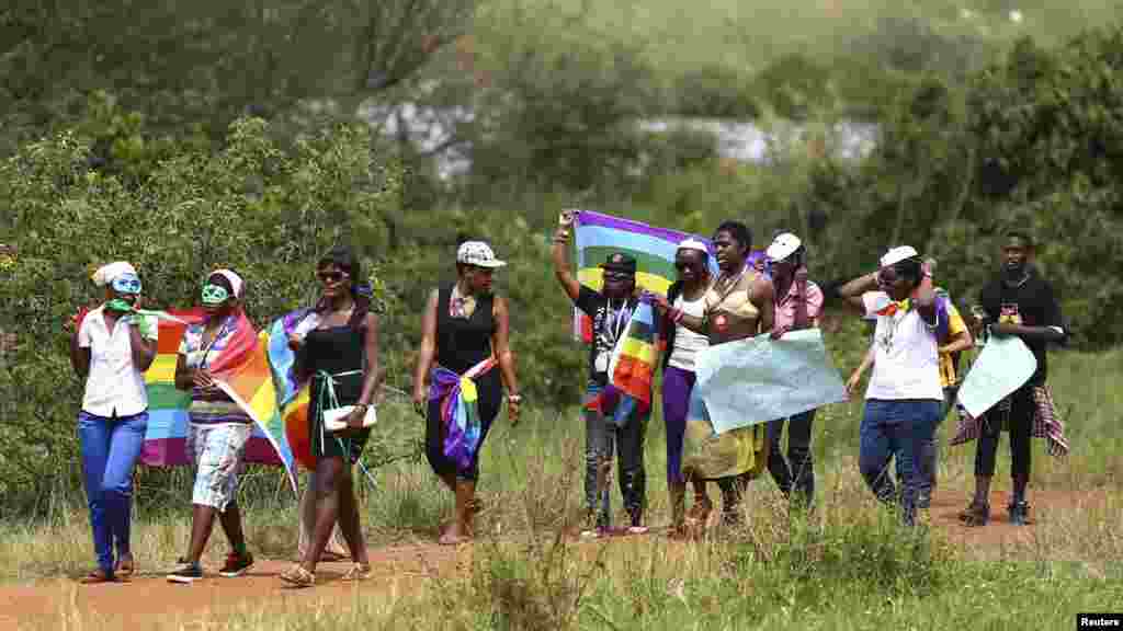 People walk in a parade as they celebrate the annulment of an anti-homosexuality law by Uganda's constitutional court in Entebbe, Aug. 9, 2014. 