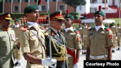 General Sher Mohammad Karimi, Afghan Army Chief of General Staff who was chief guest at passing out parade at Pakistan Military Academy, Kakul reviewing the parade, April 18, 2015.