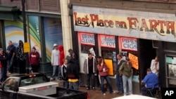 People looking to purchase designer drugs line up in front of the Last Place On Earth store in Duluth, Minnesota, in this September 21, 2011, file photo. 