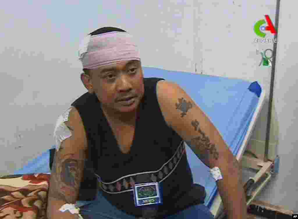 An unidentified former hostage speaks to the media in a hospital in Ain Amenas, Algeria, in this image taken from television, January 18, 2013. (Canal Algerie) 