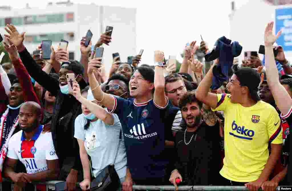 Fans wait for the arrival of Lionel Messi outside the Parc des Princes, France. The six-time Ballon d&#39;Or winner received a hero&#39;s welcome to join the Paris Saint Germain (PSG) team.