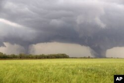 Two tornados approach Pilger, Nebraska., June 16, 2014.