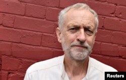 FILE - British Labor Party politician Jeremy Corbyn poses for a portrait outside of a community meeting in north London, Aug. 9, 2015.