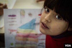 Children taking part in the Najda Now's drawing classes come live in Shatila, a Palestinian camp in the suburbs of Beirut, Dec. 4, 2015. (J. Owens/VOA)