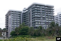 Champlain Towers North North was built in 1982, one year after South, by the same company, using the same materials and a similar design. Just one block away, the nearly 40-year-old building has also faced the same seawater and salty air as South. (AP Photo)
