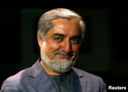 Afghan presidential candidate Abdullah Abdullah smiles during an interview in Kabul, Apr. 19, 2014.