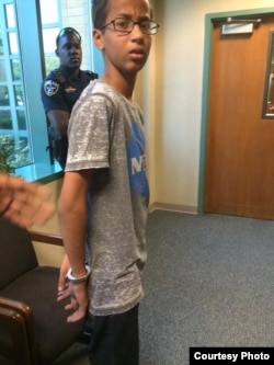 Ahmed Mohamed is seen in hadcuffs after a clock he made was mistaken for a bomb.