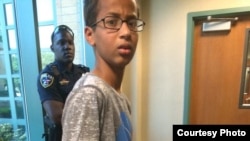 Ahmed Mohamed is seen in handcuffs after a clock he made was mistaken for a bomb.