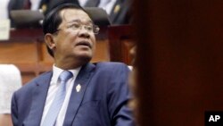 Cambodia's Prime Minister Hun Sen waits in the hall of National Assembly before a meeting, in Phnom Penh, Cambodia, Monday, Feb. 20, 2017. (AP Photo/Heng Sinith)