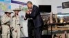 U.S. President Barack Obama greets workers in a tour displaying tools used to clear land of unexploded ordnance at the Cooperative Orthotic and Prosthetic Enterprise (COPE) Visitor Centre in Vientiane, Laos, Wednesday, Sept. 7, 2016.