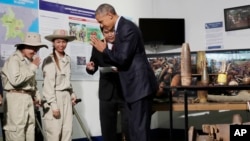 U.S. President Barack Obama greets workers in a tour displaying tools used to clear land of unexploded ordnance at the Cooperative Orthotic and Prosthetic Enterprise (COPE) Visitor Centre in Vientiane, Laos, Wednesday, Sept. 7, 2016.