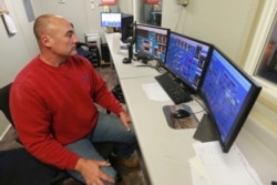 Omega Protein's Operations Manager, Monty Deihl, looks over control room screens at the menhaden processing plant on Cockrell's Creek in Reedville, Va., Tuesday, Nov. 26, 2019.
