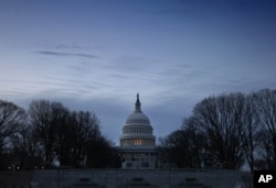 The U.S. Capitol in Washington, DC, is seen at dawn. Moody's lowered its outlook on the U.S. credit rating to "negative" from "stable" citing large fiscal deficits and a decline in debt affordability. (AP/J. Scott Applewhite)