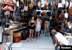 Russian tourists shop at the old medina in Sousse, Tunisia, Sept. 30, 2017.