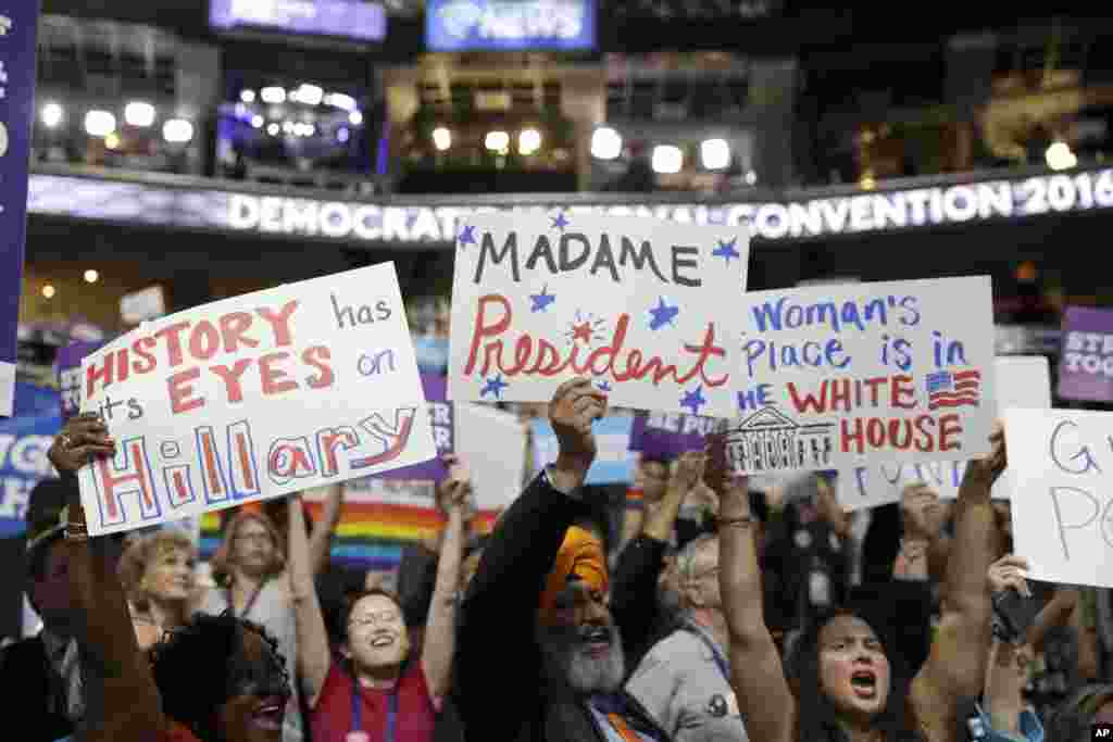 California delegates hold up signs as they cheer during the third day session of the Democratic National Convention in Philadelphia, July 27, 2016. 