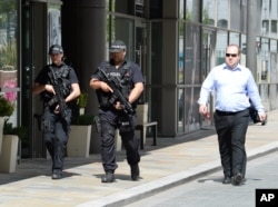 Armed police on patrol around Media City Uk, host of BBC and ITV Studios, May 23, 2017.