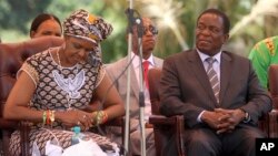 FILE - Zimbabwean first lady Grace Mugabe, left, sits next to vice President Emmerson Mnangagwa at the Zanu pf headquarters in Harare, Feb, 10, 2016.
