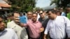 U.S. Senator Marco Rubio, R-Fla., in sunglasses, poses for photos with people near the Simon Bolivar International Bridge, which connects Colombia with Venezuela, in La Parada, near Cucuta, Colombia, Sunday, Feb. 17, 2019. 