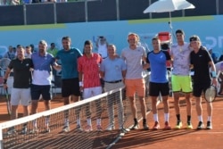 In this picture taken June 19, 2020, Serbian tennis player Novak Djokovic, fourth left, stands with other players at a tournament in Zadar, Croatia.