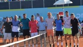 In this picture taken June 19, 2020, Serbian tennis player Novak Djokovic, fourth left, stands with other players at a tournament in Zadar, Croatia.