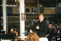 Delta David Gier leads the South Dakota Symphony Orchestra and the Porcupine Singers in a performance by the The Lakota Music Project.