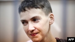FILE - Ukrainian military officer Nadezhda Savchenko attends a court hearing in Moscow, March 26, 2015.