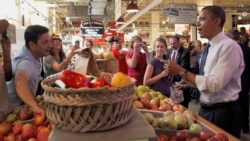 FILE - In 2010, then-president Barack Obama bought apples from a local vendor during his visit to the Reading Terminal Market in Philadelphia. (AP Photo/Pablo Martinez Monsivais)