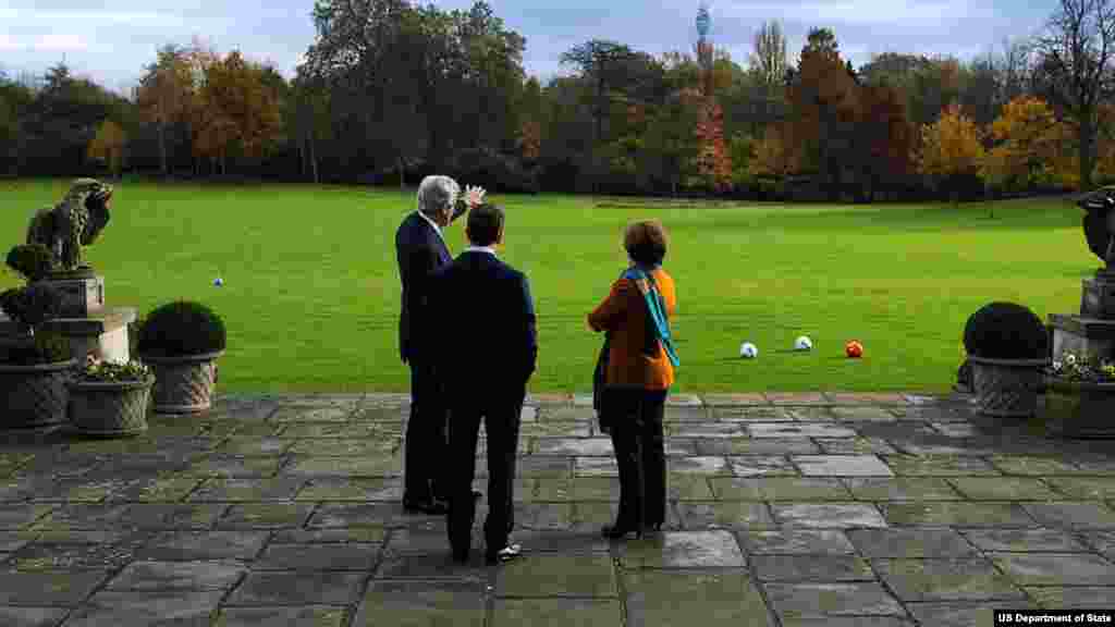 U.S. Secretary of State Kerry, E.U. High Representative Ashton and U.S. Ambassador to the UK Matthew Barzun speak together on the grounds of Winfield House, the ambassador's official residence, in London.