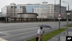 A man walks past the building of the Russian military intelligence service in Moscow, Russia, July 14, 2018. 