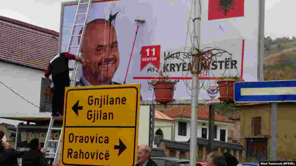 Citizens over painted black billboards Albanian Prime Minister Edi Rama in Presevo