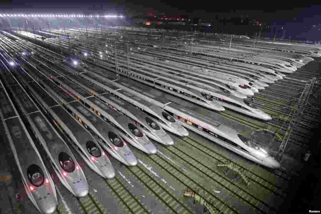 China Railway High-speed Harmony bullet trains are seen at a train maintenance base, as the Spring Festival travel rush begins, in Wuhan, Hubei province, China.