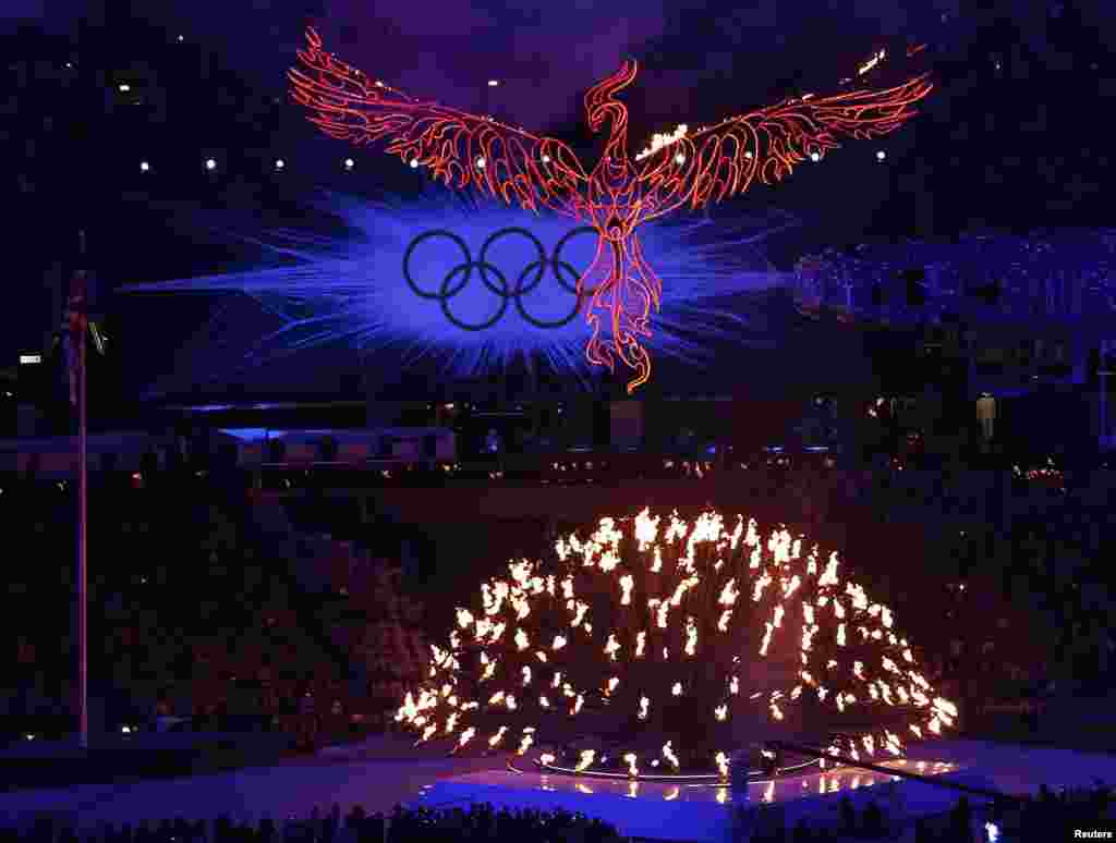A flaming phoenix flies above the Olympic flame during the closing ceremony of the London 2012 Olympic Games at the Olympic Stadium August 12, 2012.