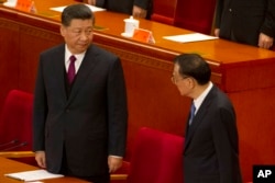 中国最高领导人习近平和中国总理李克强出席2019年4月30日举行的纪念五四运动100周年大会