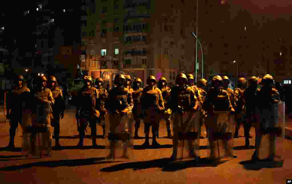 Military special forces stand guard at a street after Egypt's military chief says the president is replaced by chief justice of constitutional court in Nasser City, Cairo, July 3, 2013.