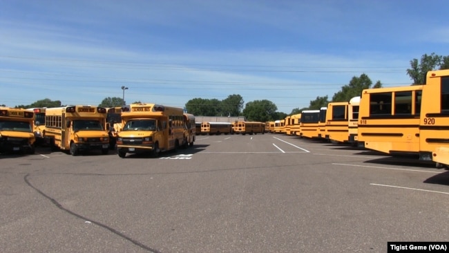 A fleet of Metropolitan Transportation Network buses in a parking lot at the company's headquarters in Fridley, Minnesota, Aug. 10, 2017.